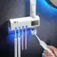 Aplicador Pasta de Dente Dispenser Porta Escovas Com Esterilizador UV em oferta