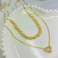 Imagem da promoção KIT 2 Choker Colar de pérolas de coração + Colar Com coração Ponto De Luz banhado a prata a ouro 18K